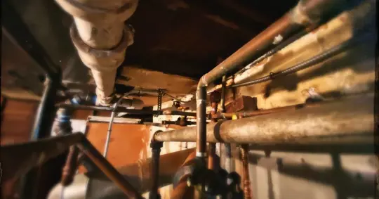 Old Pipes in a Basement Ceiling
